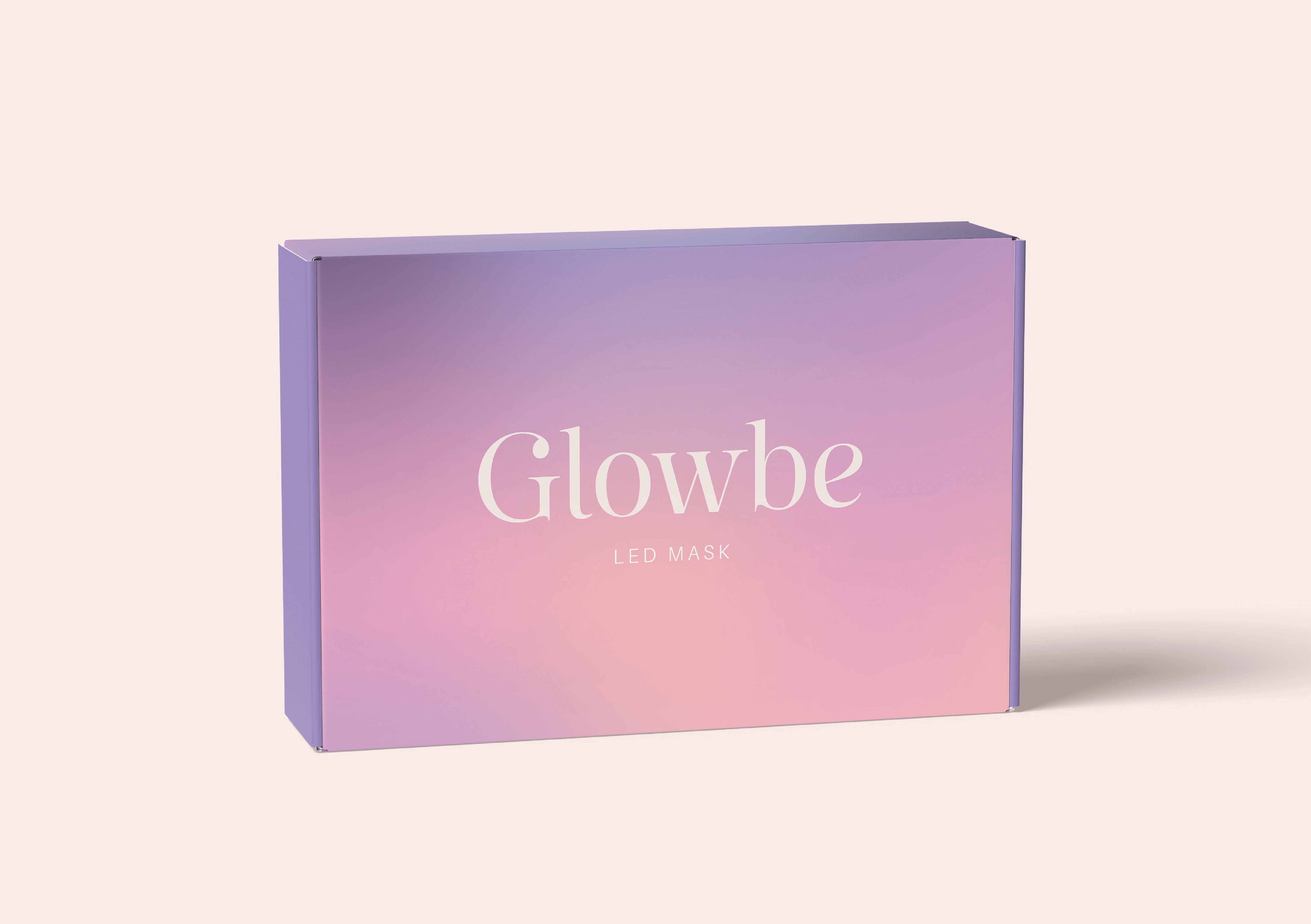 Uzavretá produktová krabička Glowbe LED Mask s ružovo-fialovým gradientom, bielym logom a minimalistickým dizajnom.