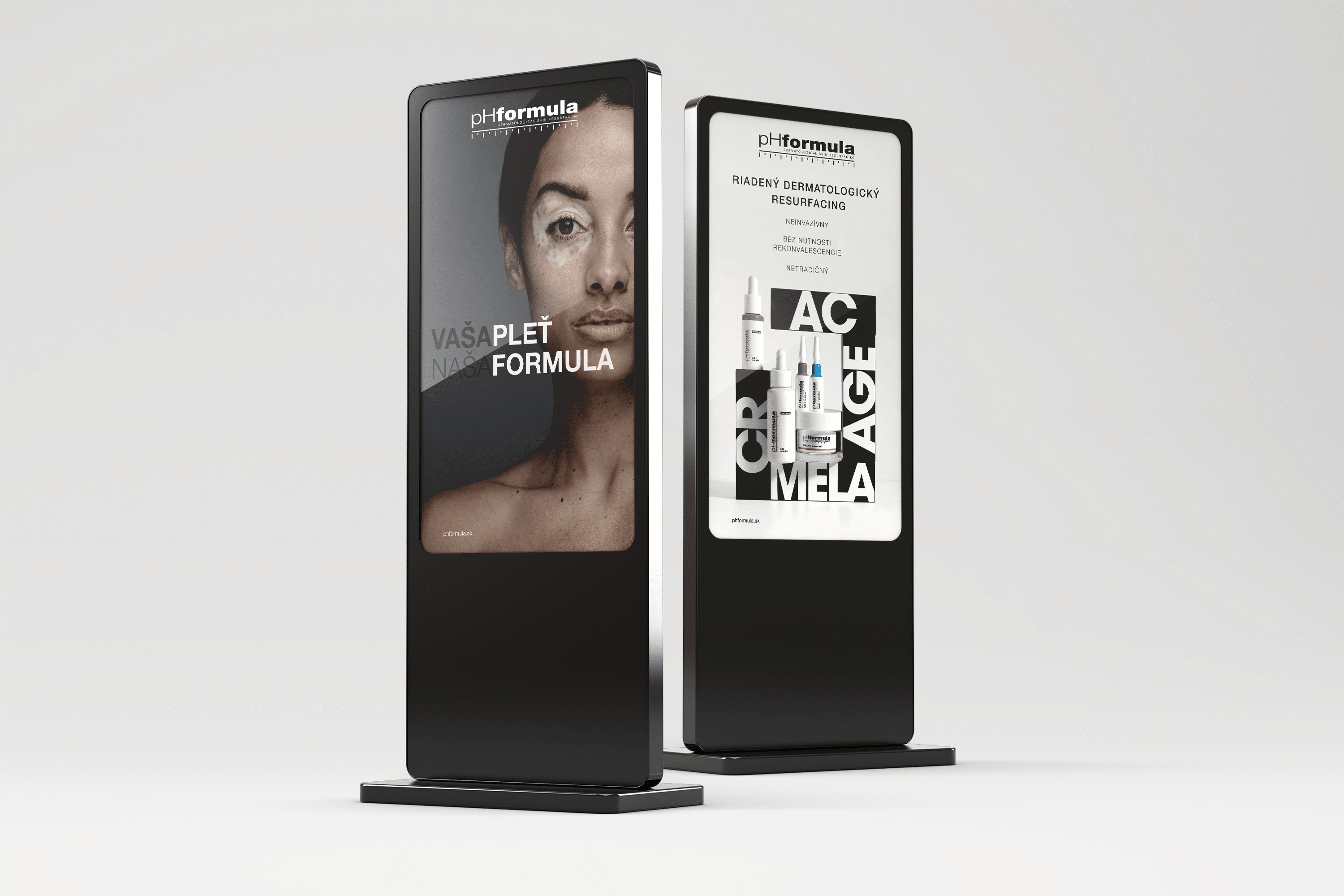 Dva čierne reklamné stojany pHformula s fotografiou ženskej tváre, kozmetickými produktmi a bielou typografiou.