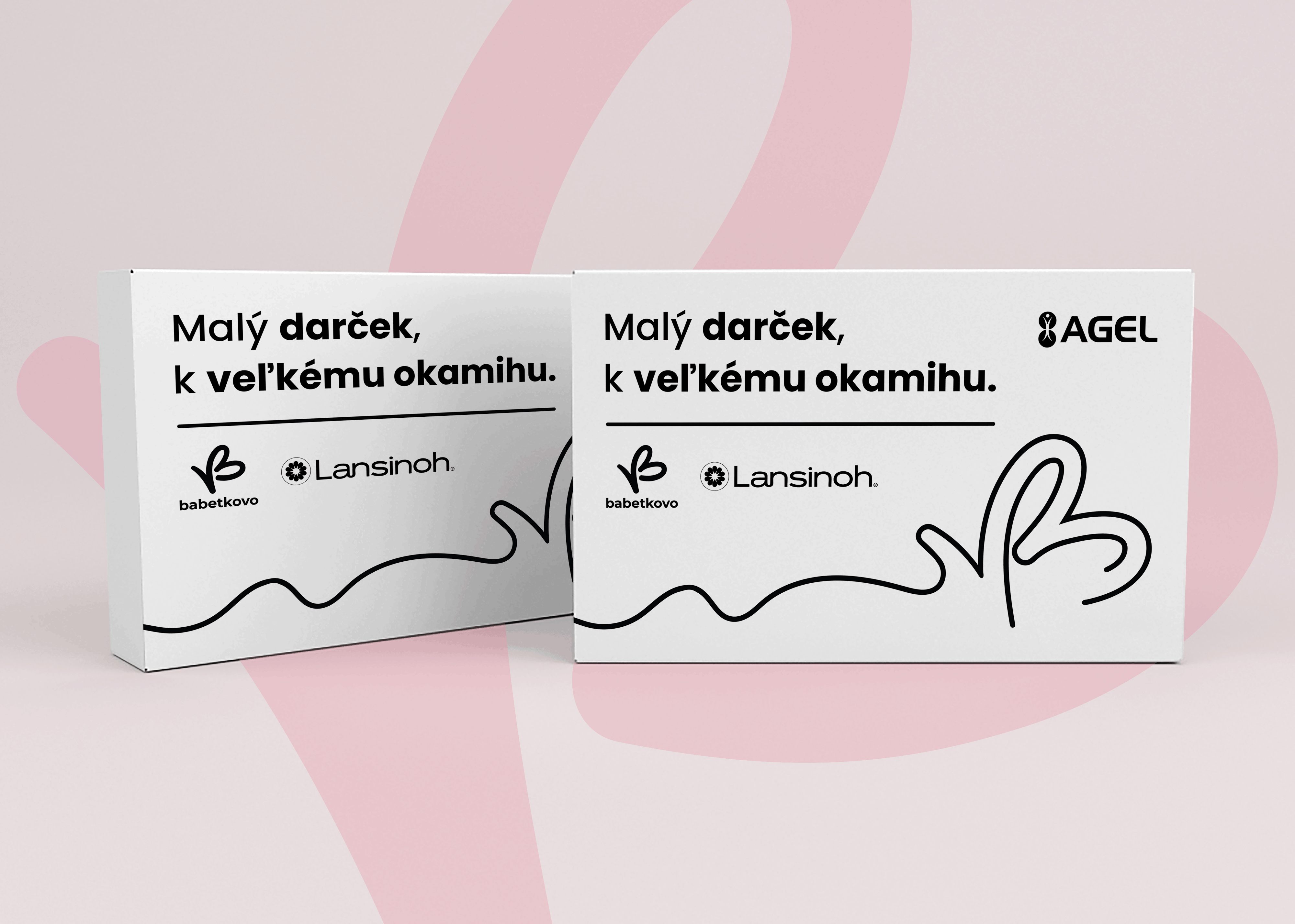Biele darčekové krabičky BABETKOVO a Lansinoh s čiernou typografiou, ilustráciou srdca a nápisom Malý darček, k veľkému okamihu.